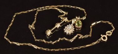 A 9ct gold chain and three 9ct gold pendants, one set with peridot and two diamonds, length 20cm,