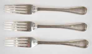 Three Victorian or Edward VII Goldsmiths and Silversmiths Company table forks with threaded edge,