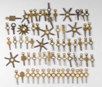 A large collection of pocket watch keys including advertising examples