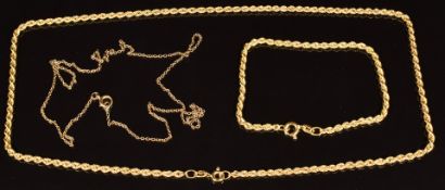 A 9k gold rope twist necklace and bracelet, lengths 18cm and 46cm and a 9ct gold chain, length 46cm,