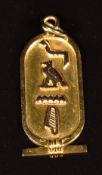 An 18ct gold Egyptian pendant with hieroglyphics spelling 