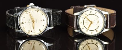 Two Smiths de Luxe gentleman's wristwatches, each with gold hands and Arabic numerals, cream dial