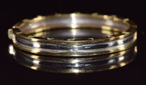 A 14k gold bi-coloured bangle, 27.2g