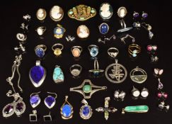 A collection of silver jewellery including pendant, ten rings, five pendants, sixteen pairs of