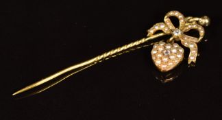 Victorian 9ct gold stick pin in the form of a bow and heart set with seed pearls and a diamond, 3.2g