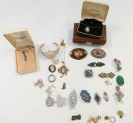 A collection of jewellery including lacquer brooch, micro mosaic brooches, moss agate brooch, silver