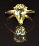 A 9ct gold ring set with a pear cut topaz, 3.3g, size M/N
