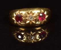 A c1910 18ct gold ring set with a rose cut diamond, paste and garnet in star settings, in original