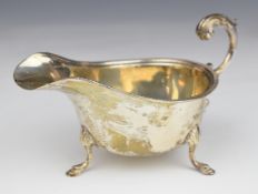 George V hallmarked silver sauce boat raised on three feet, Birmingham 1931, maker Northern