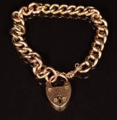 A 9ct rose gold curb link bracelet with heart padlock, length 18cm, 15.5g