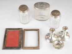 Three Victorian hallmarked silver topped cut glass dressing table bottles, height of tallest 9cm,
