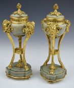 Pair of gilt metal or ormolu mounted green marble urns, with goat head and hoof supports, height