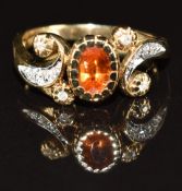 A 9ct gold ring set with an oval cut garnet and diamonds, 3.1g, size N