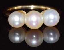 A 19thC 18ct gold ring set with three natural saltwater pearls, 2.5g, size J