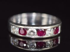 An 18k white gold ring set with diamonds and rubies, 4.2g, size N