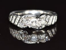 A platinum ring set with round cut diamonds, total diamond weight approximately 0.5ct, 8g, size I