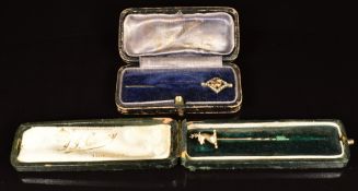 A 9ct gold stick pin in the form of a stag and an Edwardian 9ct gold stick pin in the form of a stag