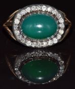 An early Victorian rose gold ring set with a chalcedony cabochon surrounded by rose cut diamonds,