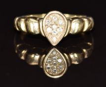A 9ct gold ring set with diamonds in a pear shaped setting, 4.6g, size O