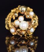 A 1970s 9ct gold ring set with pearls in a textured mount, Birmingham 1971, 9.2g, size M