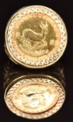 A 9ct gold ring set with a 1983 gold 1/10 Krugerrand, 6.7g, size I