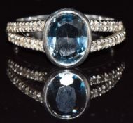 A 9ct white gold ring set with topaz, 3.9g, size M/N