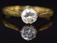 An 18ct gold ring set with a round cut diamond of approximately 0.66ct, 2.7g, size N