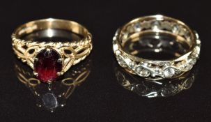 A 9ct gold eternity ring set with spinel and a 9ct gold ring set with a garnet, 4.4g, size J & I