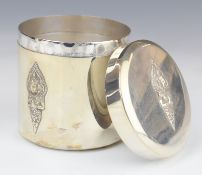 Thai silver dressing table pot with embossed decoration of deities to sides and lid, marked to