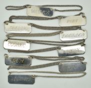 Nine silver bottle tickets, each marked sterling, comprising Port, Sherry, Vodka, Cognac, Whisky,