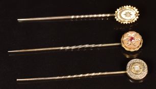 Three Victorian 15ct gold stick pins set with ruby and diamonds, 2.6g