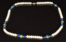 A necklace of pearl, malachite, lapis lazuli and 14k gold beads, with 14k gold clasp