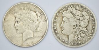 1891 Morgan US silver dollar with New Orleans Mint mark and a 1923 Liberty / Peace dollar