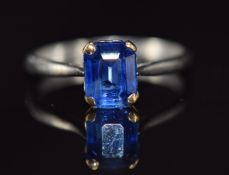 A platinum ring set with an emerald cut sapphire of approximately 1ct, 3.2g, size N