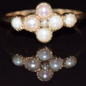 A 9ct gold ring set with pearls, 1.9g, size M