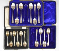 Three cased sets of hallmarked silver teaspoons comprising a set of six with tongs, having Arts