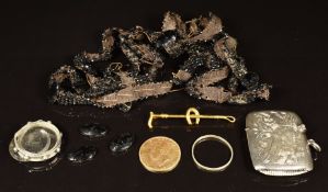 A hallmarked silver vesta, rolled gold brooch in the form of a crop and horseshoe, a section of