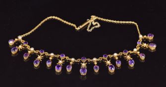 Edwardian 9ct gold necklace set with seven round cut amethysts, fifteen oval cut amethysts, split