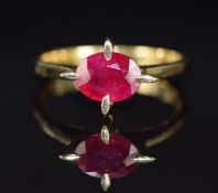 An 18ct gold ring set with an oval cut ruby of approximately 1.5ct, 3.7g, size M/N