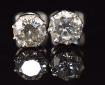 A pair of 18ct white gold c1920s earrings each set with a diamond of approximately 0.85ct, 2.2g