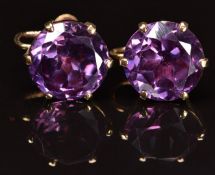 A pair of 9ct gold earrings each set with synthetic purple sapphire, 12.6g