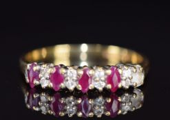 An 18ct gold ring set with rubies and diamonds, 2.9g, size O