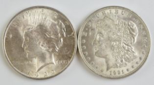 1921 Morgan US silver dollar and a 1922 Liberty / Peace dollar