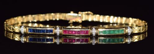 An 18ct gold bracelet set with calibre cut sapphires, rubies and emeralds with round cut diamonds