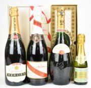 Four bottles of Champagne comprising Mumm, 75cl, 12%, Mercier 75cl and L'Empereur reserve, all boxed