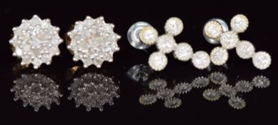 A pair of 9ct white gold earrings in the form of a cross set with diamonds, and a pair of 9ct gold