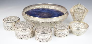 Thai or similar silver dressing table set comprising bowl/tray, four covered pots, small bowl and