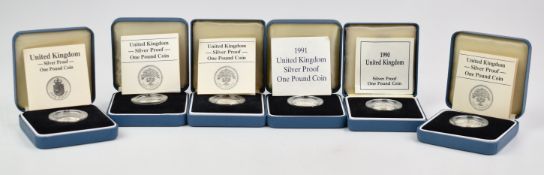 Six cased Royal Mint proof silver 'round pound' coins, various reverses, issued between 1980 and