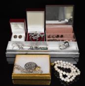 A collection of jewellery including a single strand of cultured pearls with 9ct gold clasp, silver