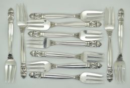 Set of eleven Georg Jensen silver acorn pattern cake forks, each marked Georg Jensen sterling